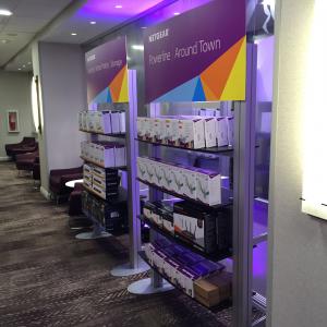 RENTAL: Ballroom Product Showcase with (8) RE-1207 Counters with Custom Laminated Tops, (32) Small Custom Black Laminated Product Shelves, (8) RE-1229 Large Monitor Kiosks, (8) Modified RE-1253 Freestanding Shelf Displays -- Image 3