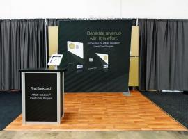 Custom SEGUE Exhibit with SEG Graphics, iPad Stand, and MOD-1551 Counter with Storage
