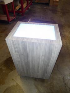 Custom MOD-1565 Product Pedestal with Acrylic Uplighting, LED Perimeter Light, and Locking Storage
