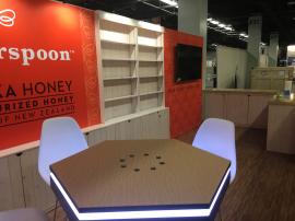 Custom Wood Exhibit with Shelves, Cabinets, SEG Graphics, Lighting, and MOD-1450 Charging Table with Graphics