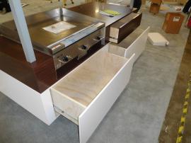 Custom Grilling Demonstration Station with Mirrored Ceiling and Storage Drawers