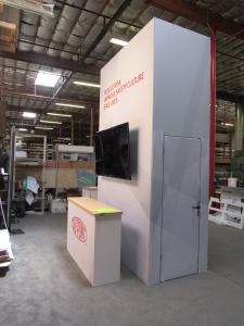 Modified VK-5166 Island Exhibit with Gravitee Tower, Walk-in Storage, (2) Workstation Kiosks with Monitor Mount and Locking Storage, and (6) Custom Counters with Storage