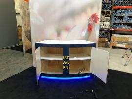 RENTAL: Modified RE-9094 Island Gravitee One-Step System Design with Large Monitor Mount, Large Custom Curved Counter, SEG Fabric Graphics, and Vinyl Counter Graphics