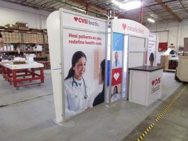 Custom Hybrid Display with Large Monitor Mount, Attached Counter with Locking Storage. Fabric and Direct Print Graphics