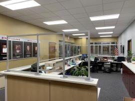 Custom Office Safety Partitions for a Large Administrative Counter Constructed with Engineered Aluminum and Clear Acrylic