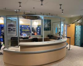 Curved Reception Desk Safety Dividers Constructed with Engineered Aluminum and Clear Acrylic
