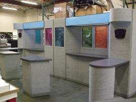 Intro Fabric Panel Display with Alcove Counters, Peninsula Counters, Backlit Headers, and Monitor Mounts -- Image 1